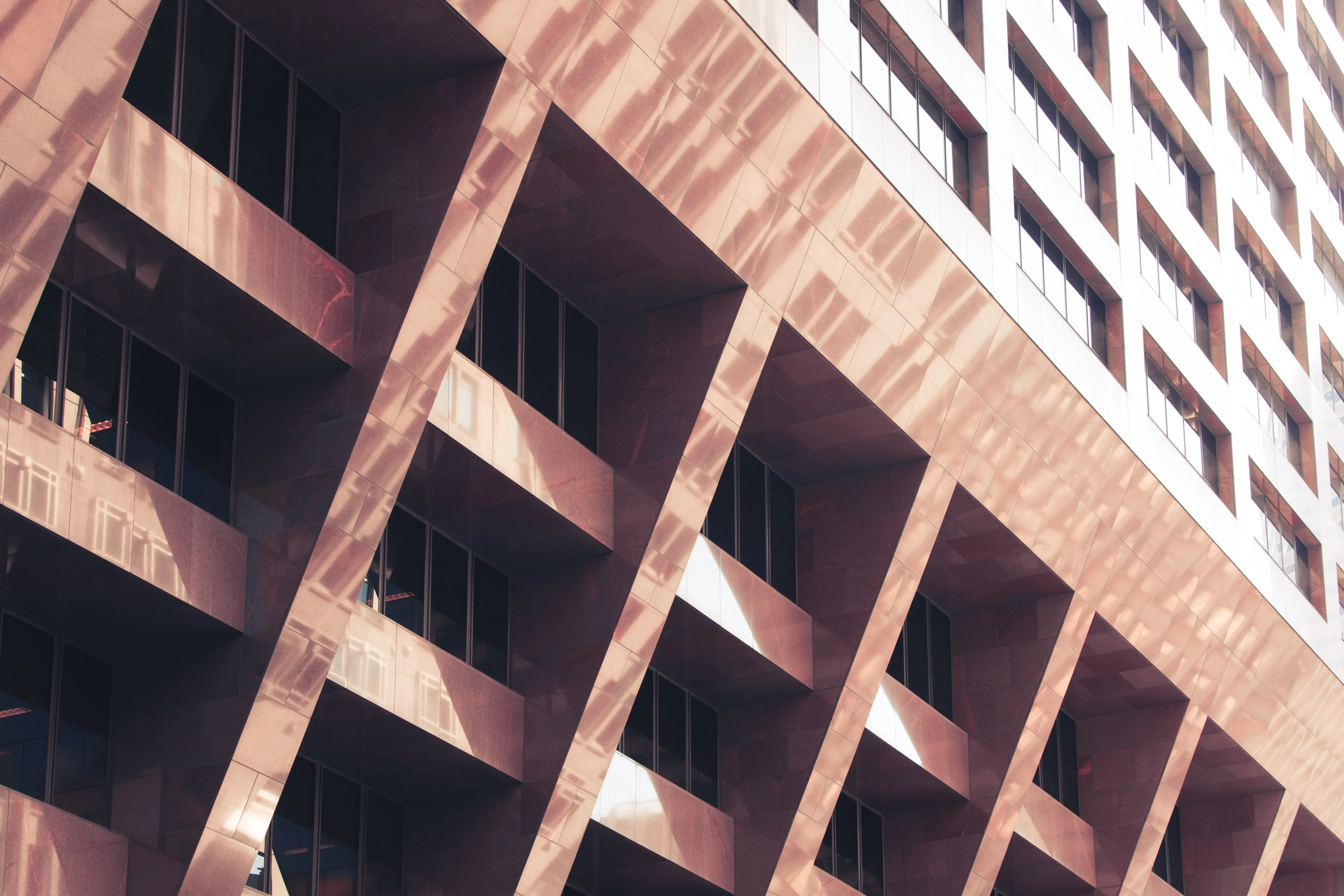 Modern building facade with angled concrete balconies